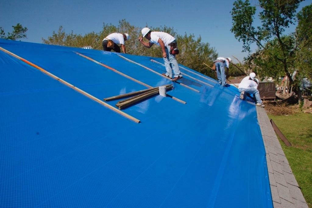 Men Tarping a Roof